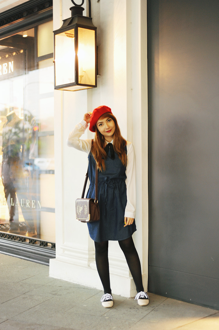 blue denim and red hat